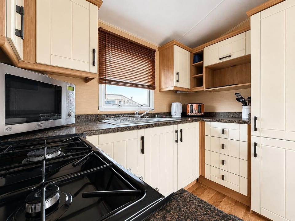 Bright and functional kitchen space ideal for preparing family meals.