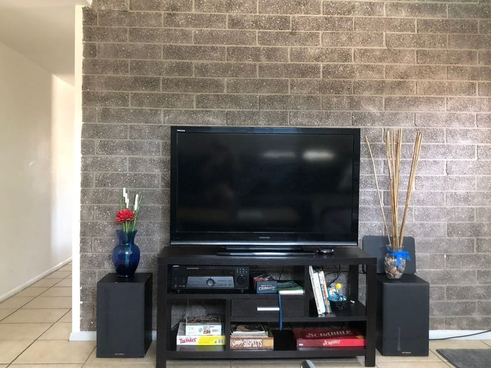 Watch a movie, play a game or just chill in this cozy back living room. 65in TV!