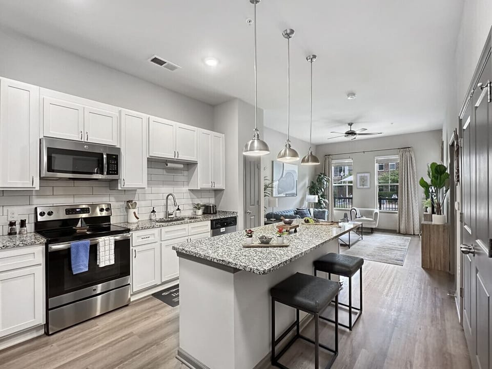 Open Concept with 1` Ceilings and View of the Pool