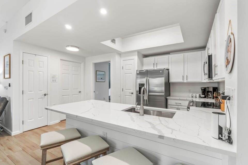 Kitchen with Granite Counters, glass top stove, microwave, dishwasher & Refrig.