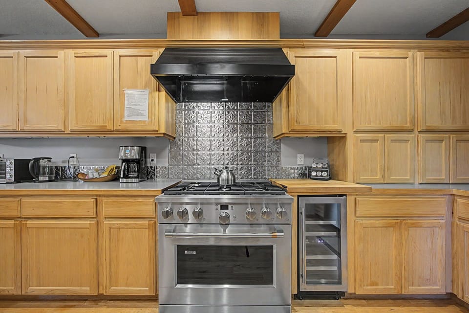 Prepare your favorite dishes on the gas stove, along with a wine cooler and extensive counter space.
