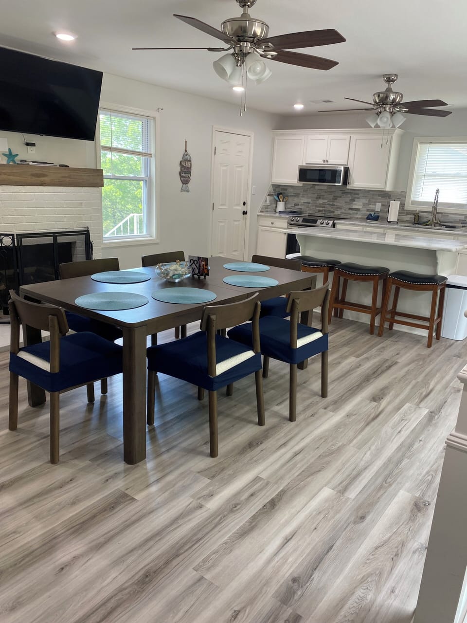 Dining room table seats 6,  3 more at the bar. Everyone eats in the same room!