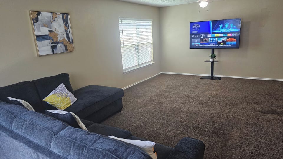 Unwind in our cozy living room, perfect for relaxing movie nights and entertainment.