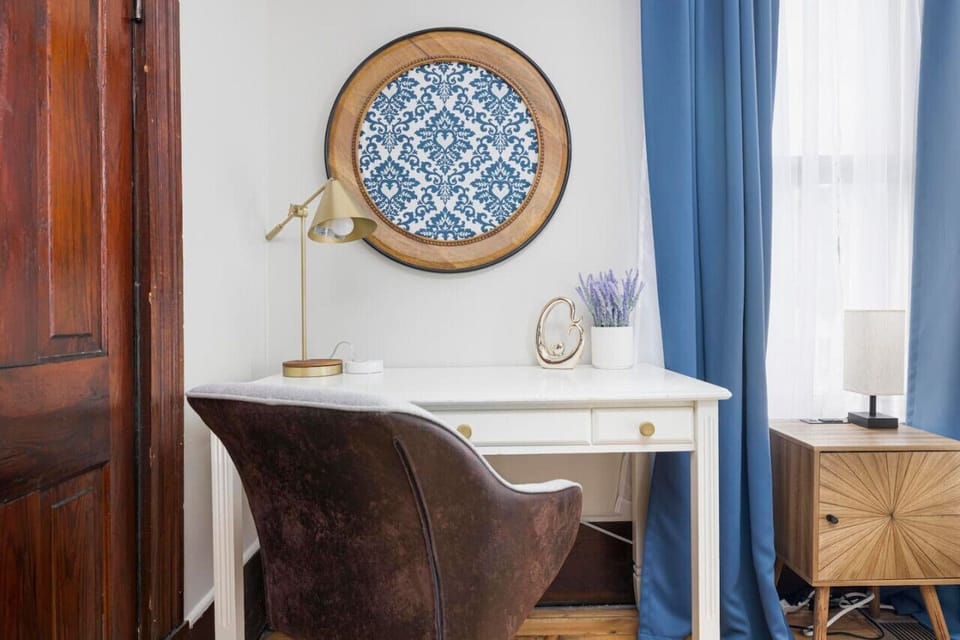 Stay productive in the comfort of your bedroom with this dedicated desk space, ideal for work or creativity.