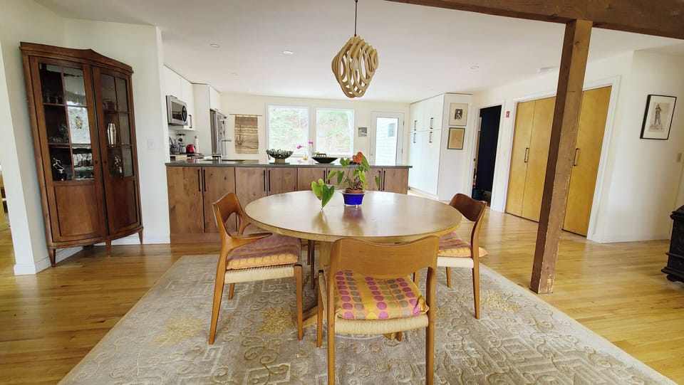 Dining area with kitchen beyond