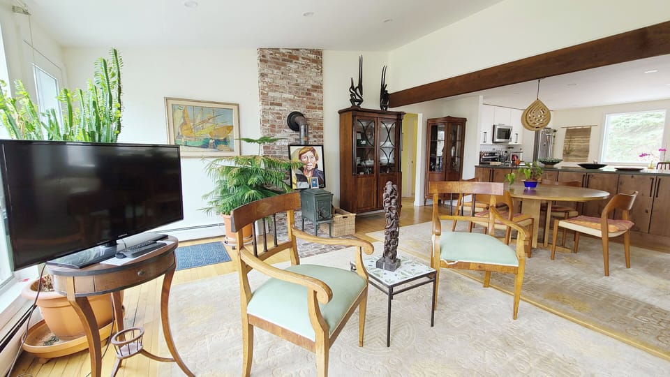 Living room with dining area and kitchen beyond