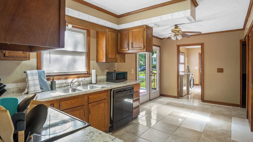 Tiled kitchen, where a sleek ceiling fan enhances airflow and comfort