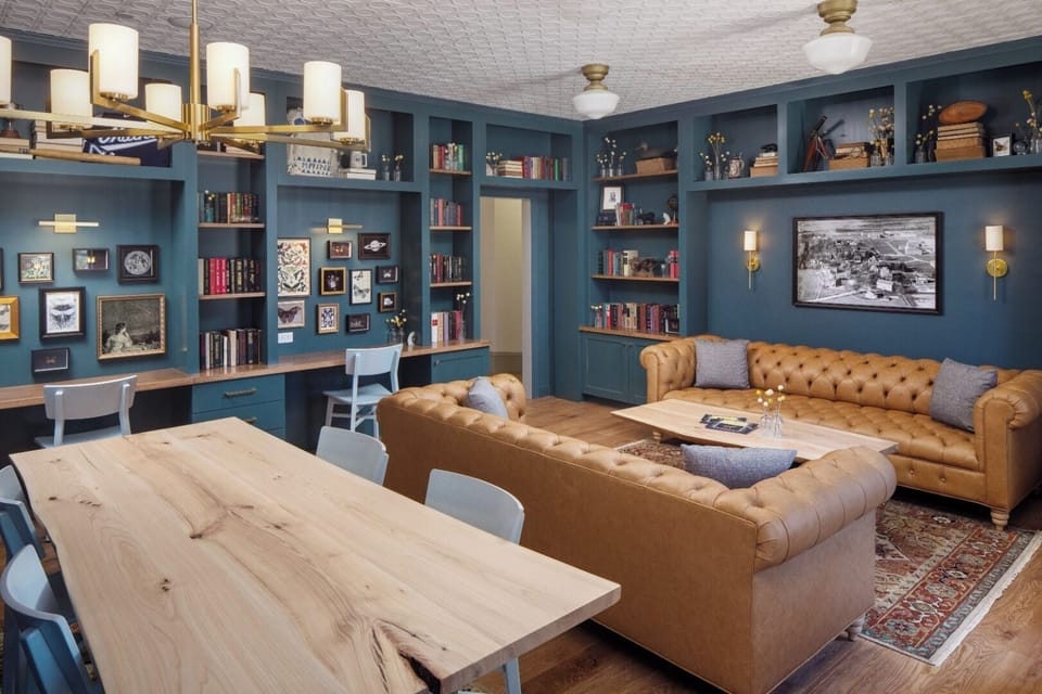 Unwind in the cozy library lounge surrounded by curated bookshelves.