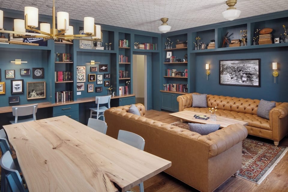 Unwind in the cozy library lounge surrounded by curated bookshelves.
