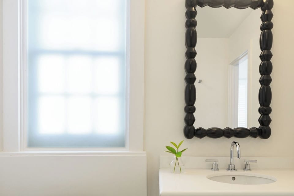 Refresh at the sleek vanity with spa-simple calm.