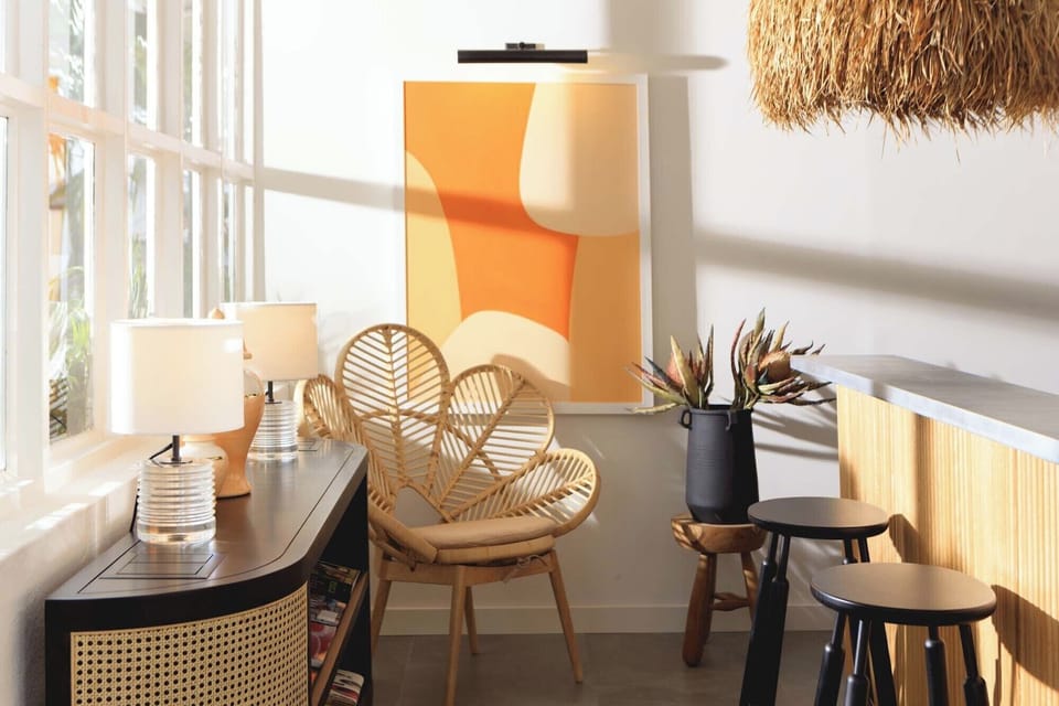 Linger with a drink in a serene, sun-washed corner nook.
