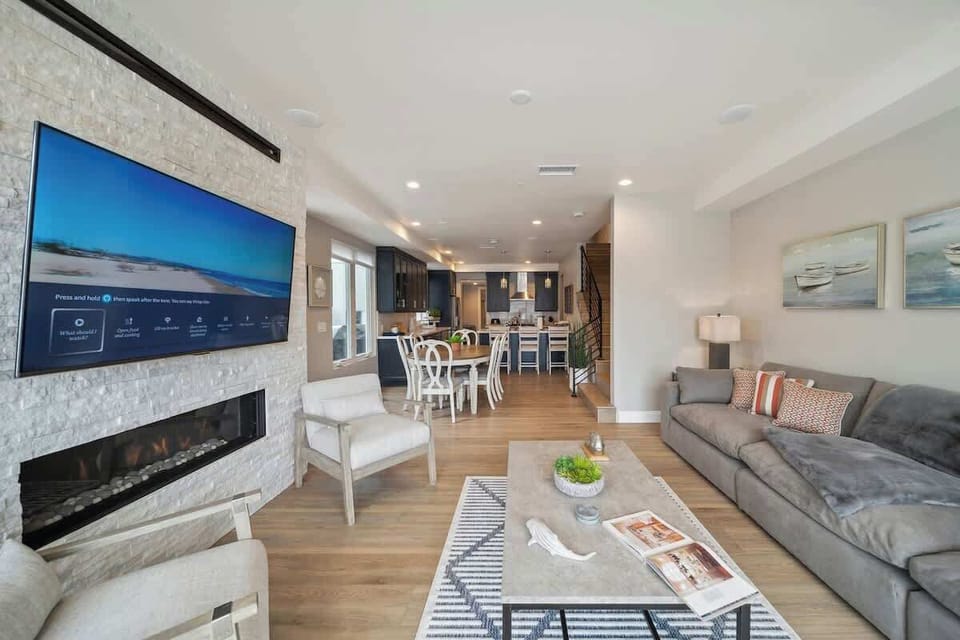 Relax and watch your favorite shows on the wall-mounted Smart TV above the cozy fireplace