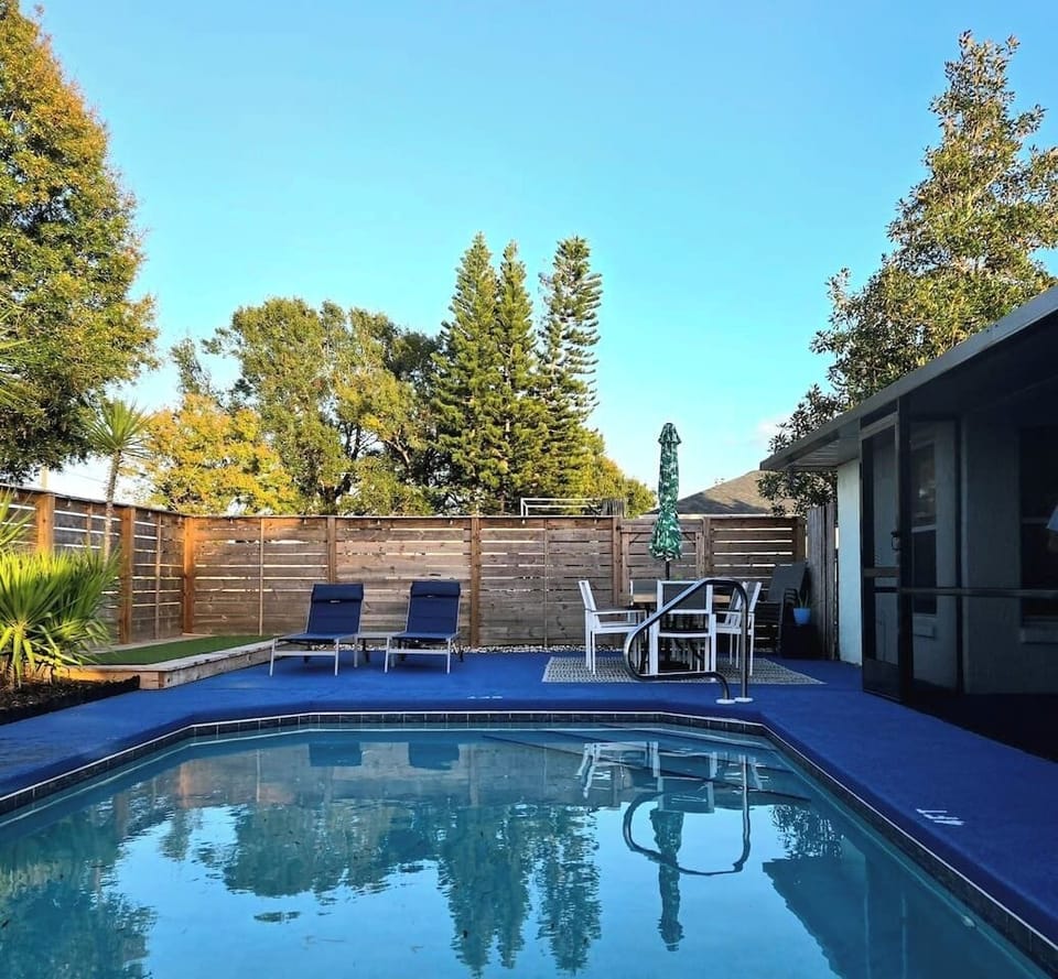 Lovely private pool area with loungers, dining table with seating for 6