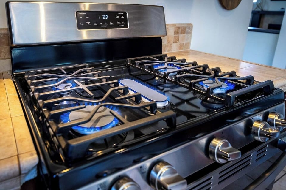 Unleash your inner chef with a sleek modern gas range, perfect for cooking fun.