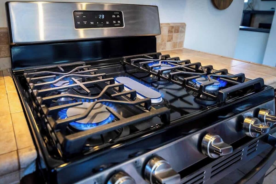 Kitchen: Unleash your inner chef with this sleek, modern gas range, ready for culinary adventures!