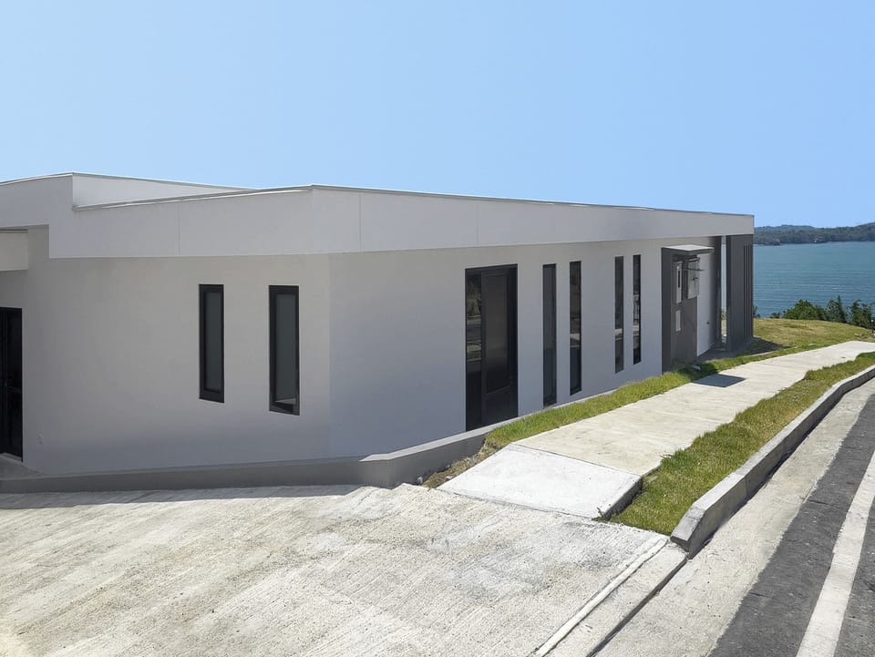 Front of the house with parking entrance