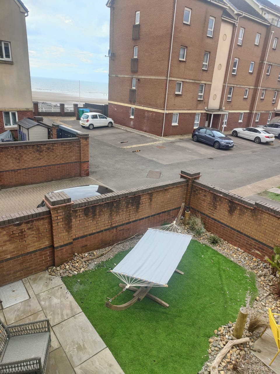 view from living room overlooking garden and out to the beach 
