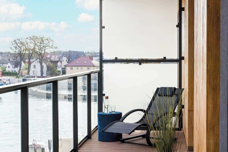 Balcony with comfortable furniture allowing you to relax and enjoy the view. 