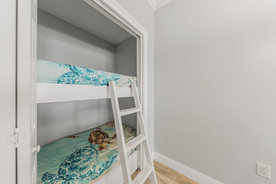 Twin bunkbed in nook off the dining area.
