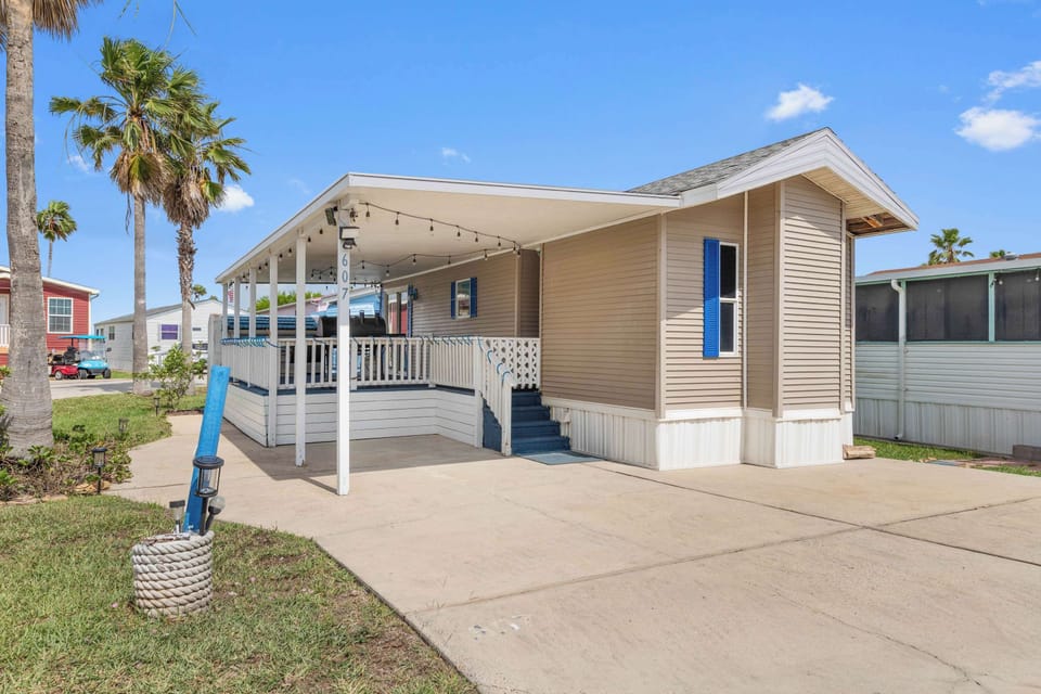 Pull right up to the carport at your single-level coastal cottage