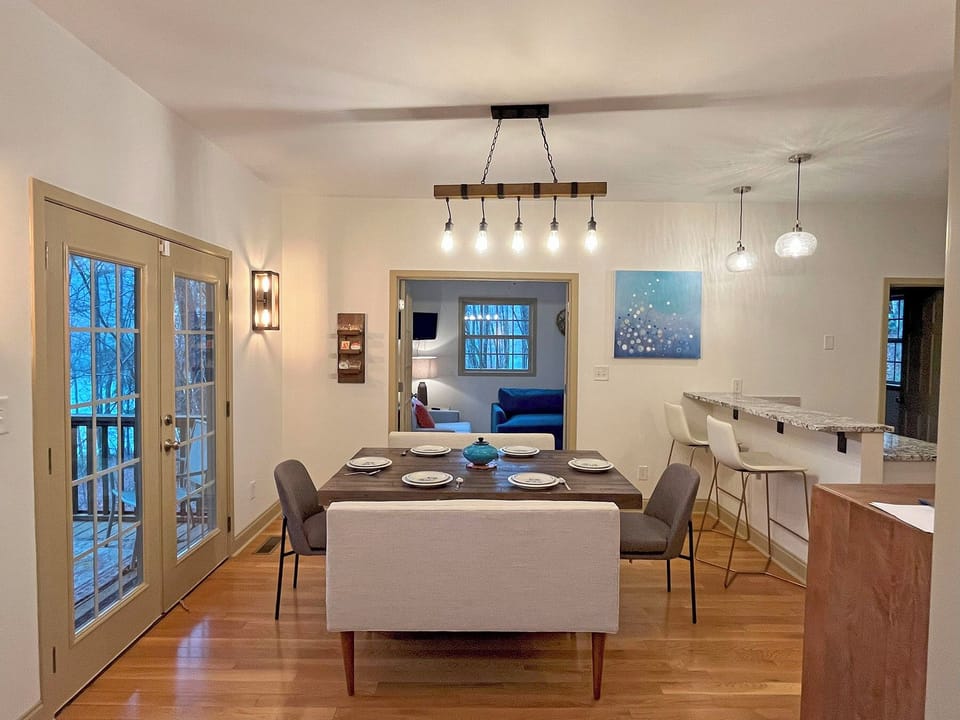 Dining Table seats 8, plus 2 additional seats at the Kitchen breakfast bar.  Dining area also has access to the wrap-around Screen Porch.