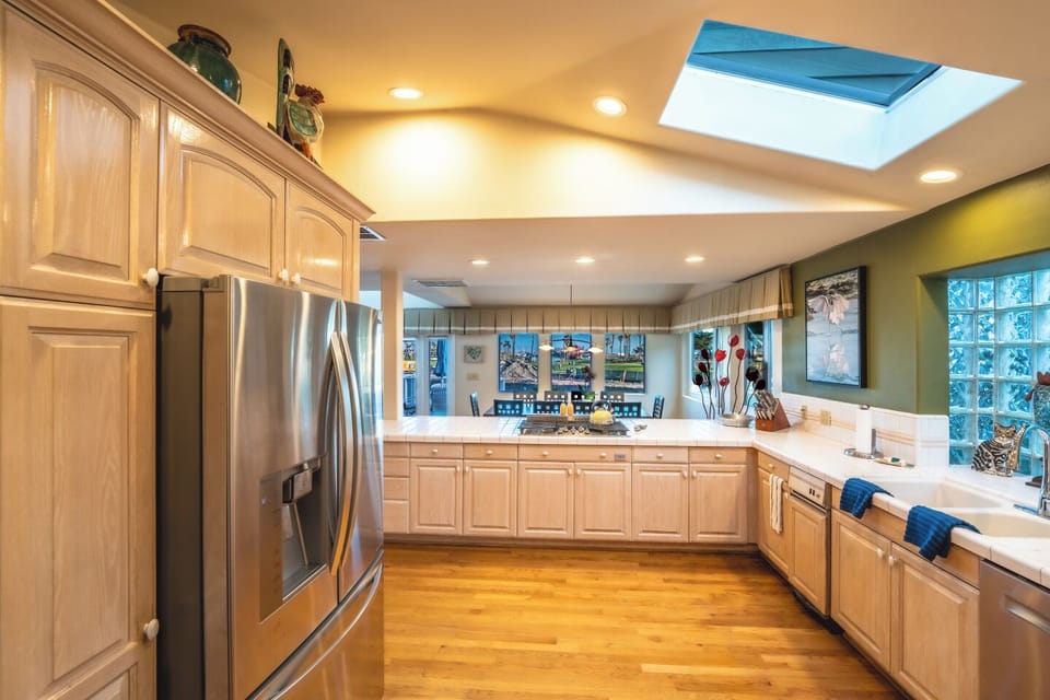The modern kitchen features cooking basics and appliances.		