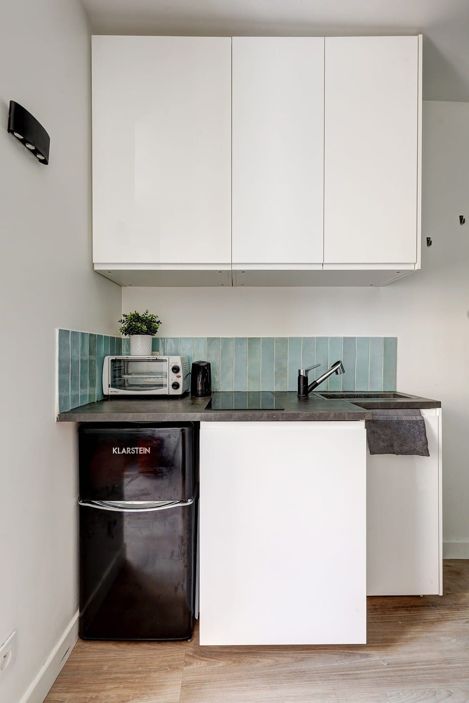 The kitchen is fully equipped to prepare a simple meal