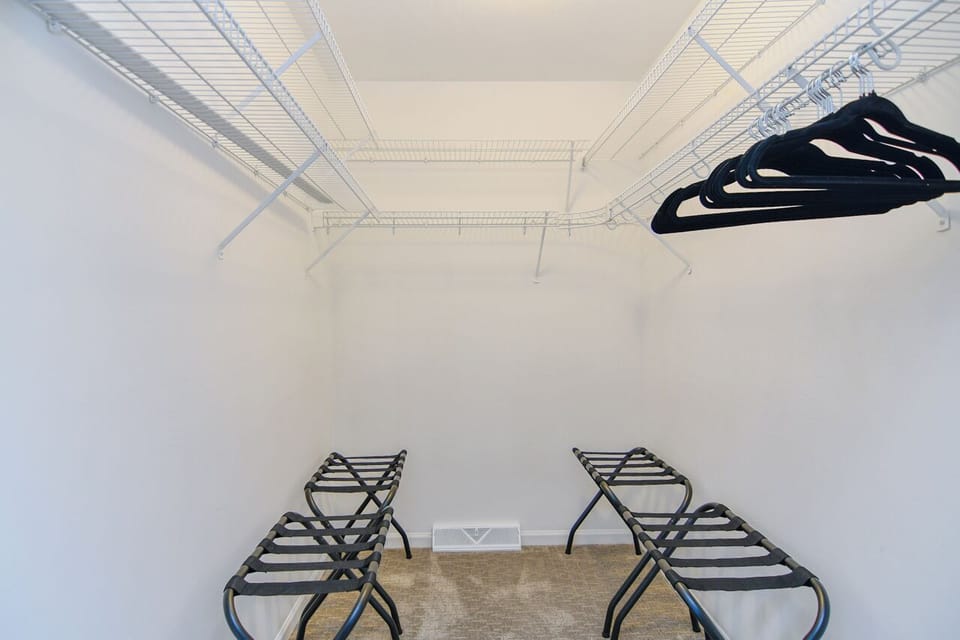 Primary bedroom walk in closet