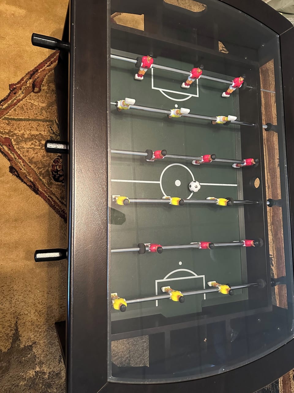 The basement coffee table is a playable foosball game