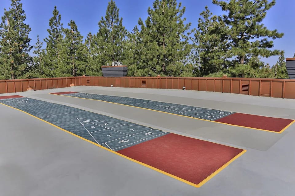 Play a quick shuffleboard match under crisp mountain air.