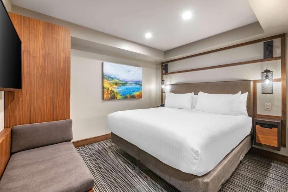 Kick back with a movie in bed and plush seating nearby.