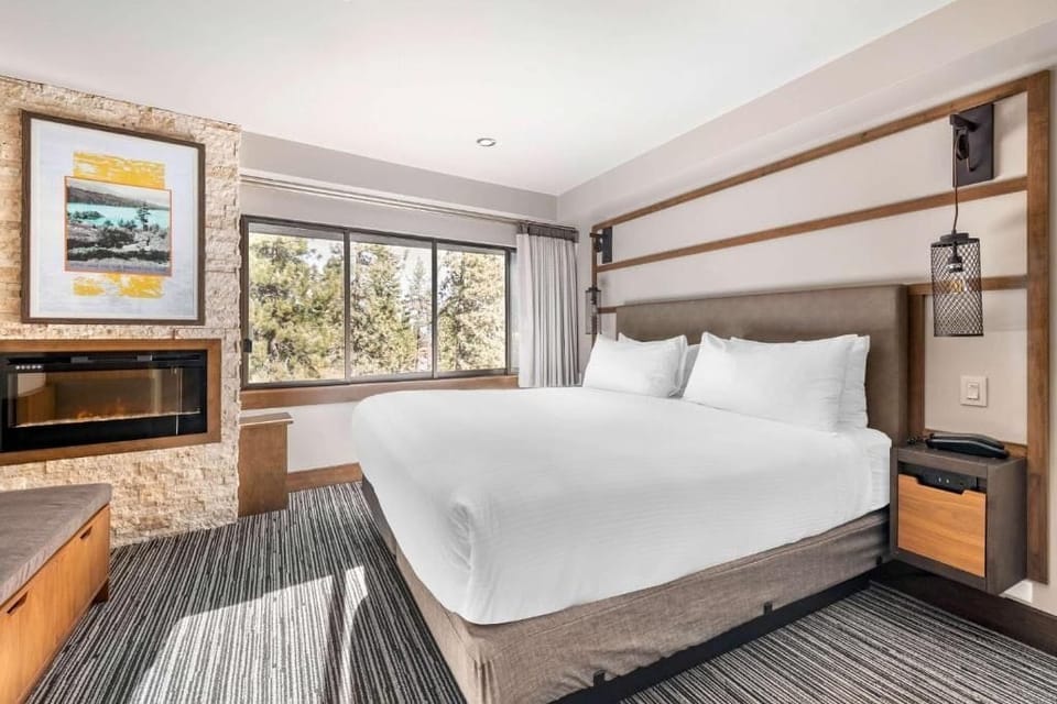 Sink into crisp linens in a calm, modern king retreat.