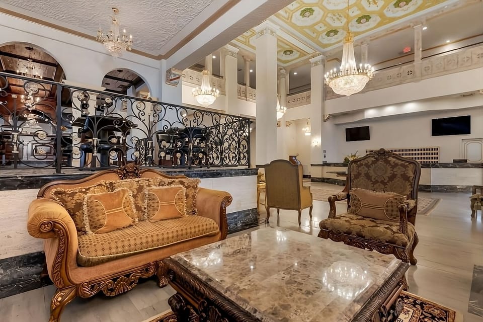 Settle into plush seating and linger under glowing chandeliers.