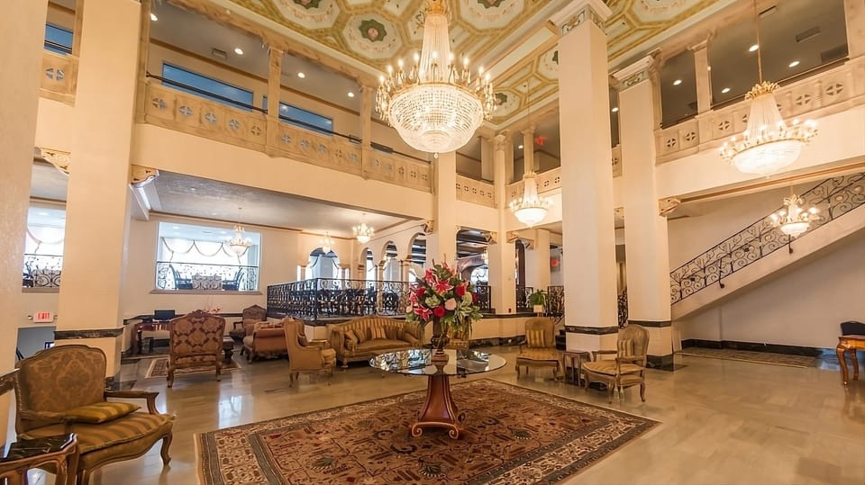Wander through airy halls framed by chandeliers and ornate details.