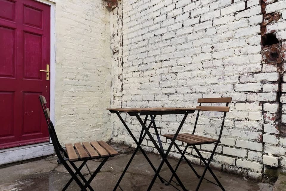 Step into the back garden and unwind in the peaceful seating area — the perfect spot to relax, enjoy the fresh air, and soak up the tranquility