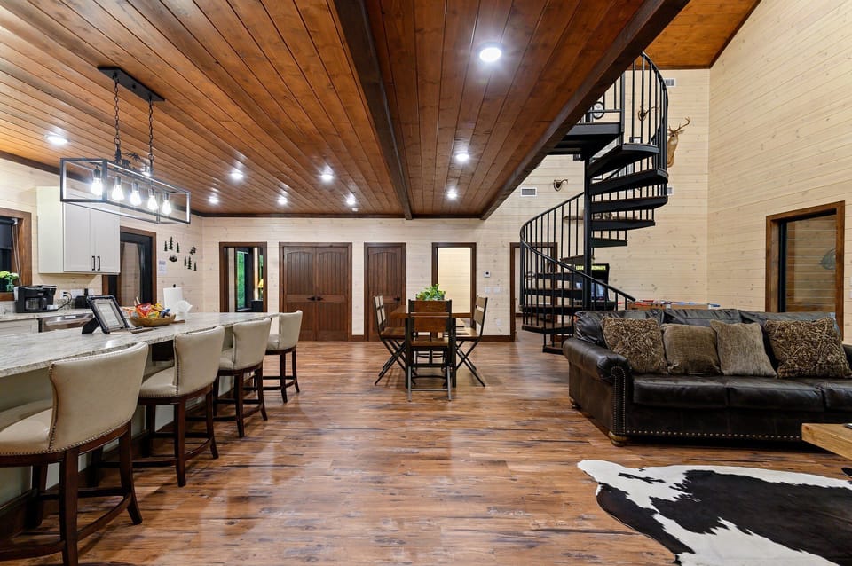 The cabin also features a dining area, perfect for enjoying meals together prepared in the fully stocked kitchen.