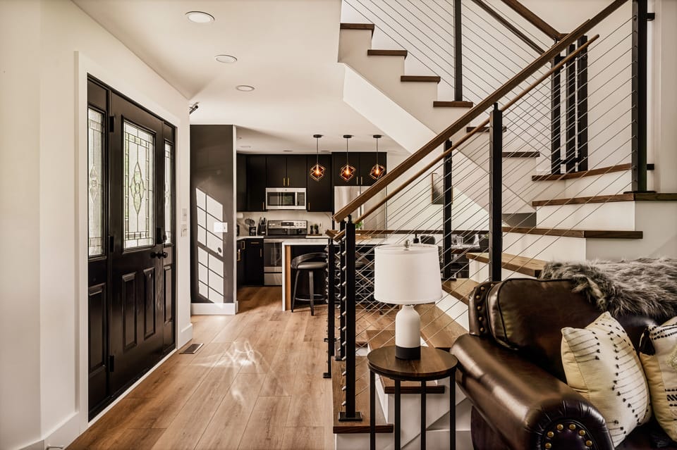 Open Floor next to Living Room with view of full size kitchen