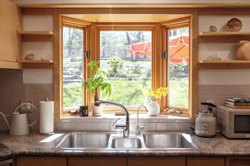 Enjoy views of the yard while cleaning up after brunch!