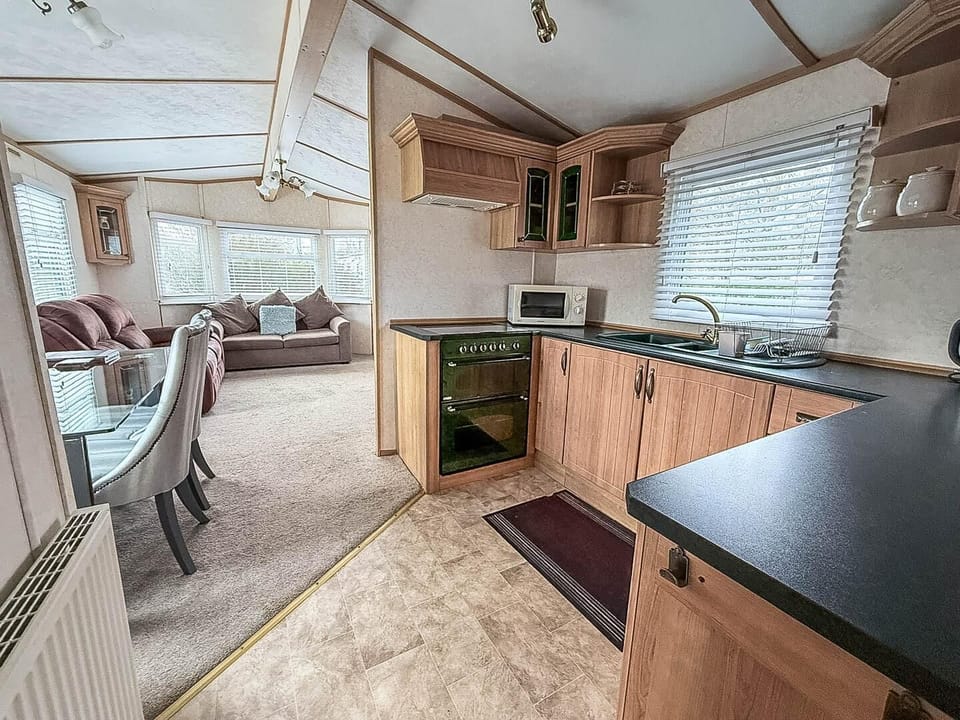 Experience the convenience of a comfortable kitchen during your stay at Parkdean Resorts Southview Holiday Park Skegness, perfect for last-minute weekend getaways with the family.