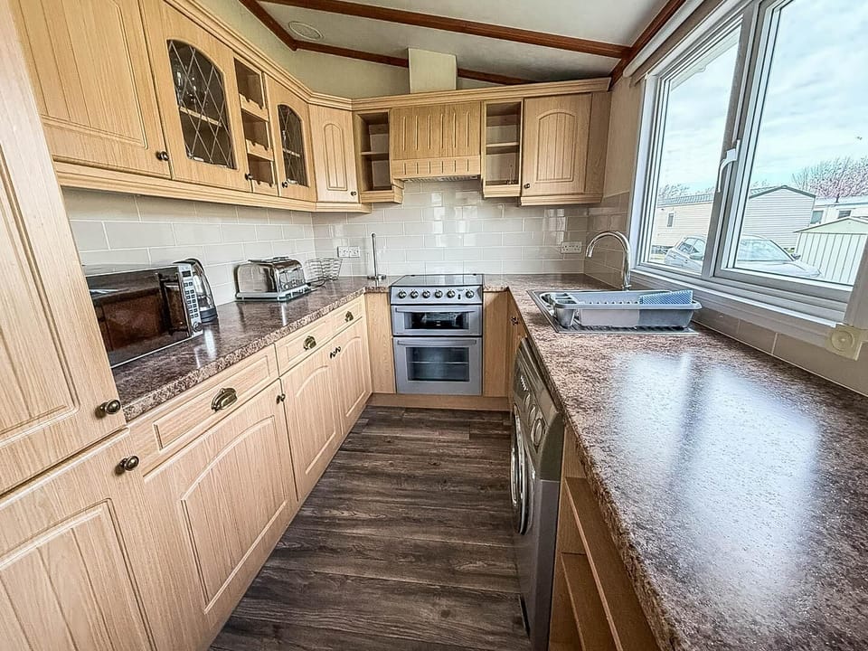 Enjoy the comfort of a kitchen area in a caravan during your stay at Parkdean Resorts Southview Holiday Park Skegness, perfect for a self-catered UK staycation.
