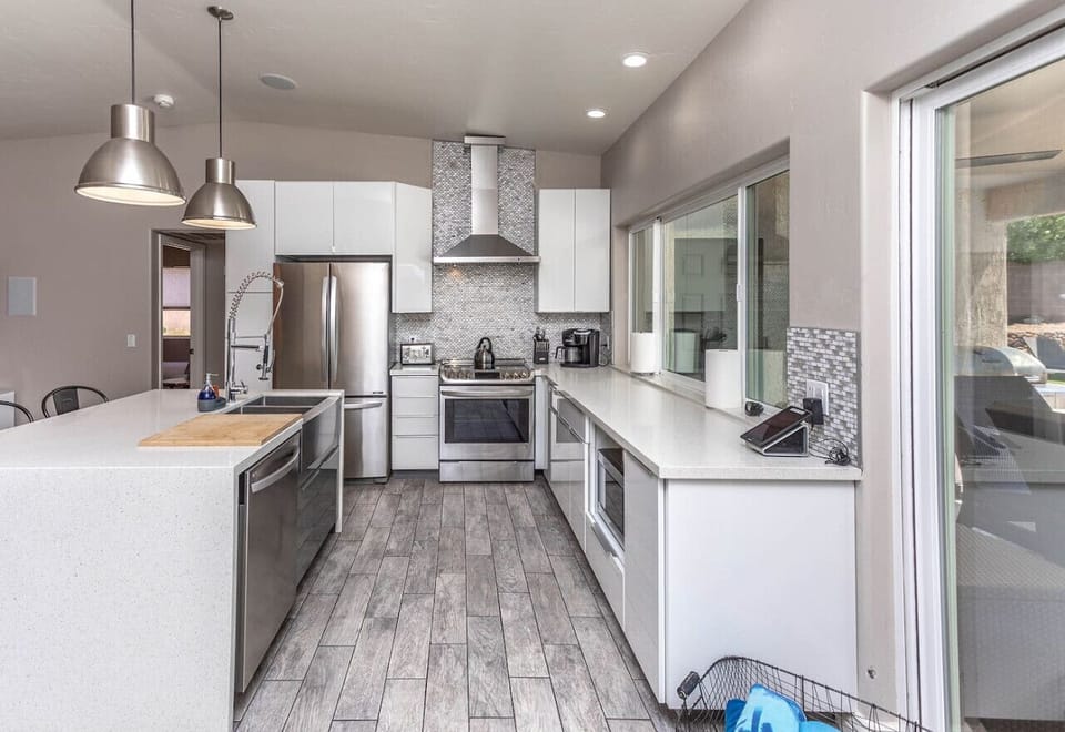 Modern kitchen, equipped with stainless steel appliances and plenty of counter space.