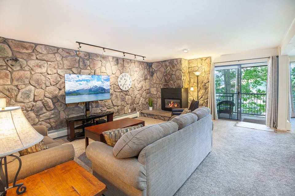 Updated floor plan living room with mountain and lake views