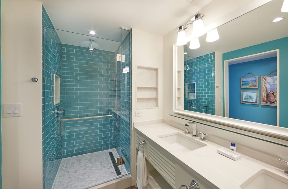 Refresh in a spa-like bath with a sleek glass shower.
