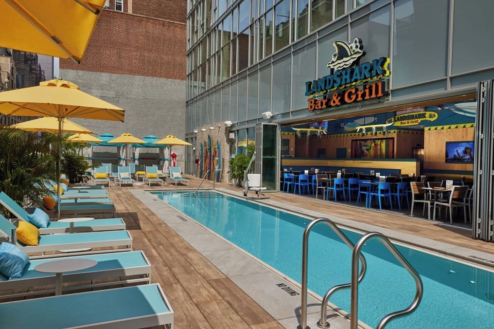 Unwind poolside with tropical cocktails steps from your lounger.
