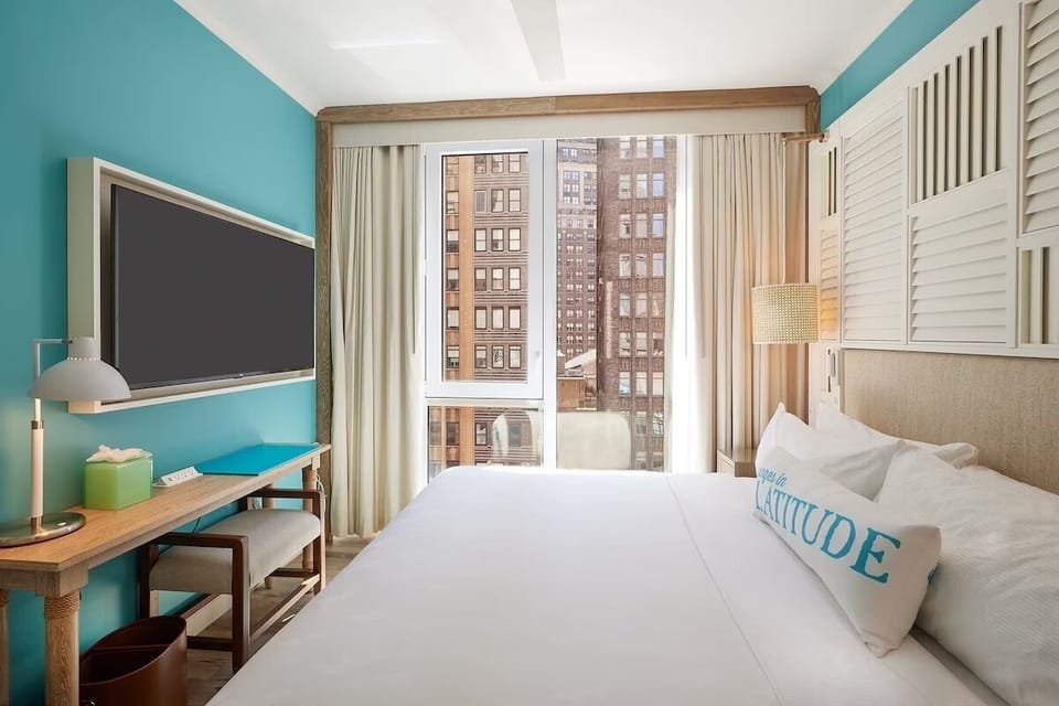 Stretch out in a serene room with a dedicated work spot.