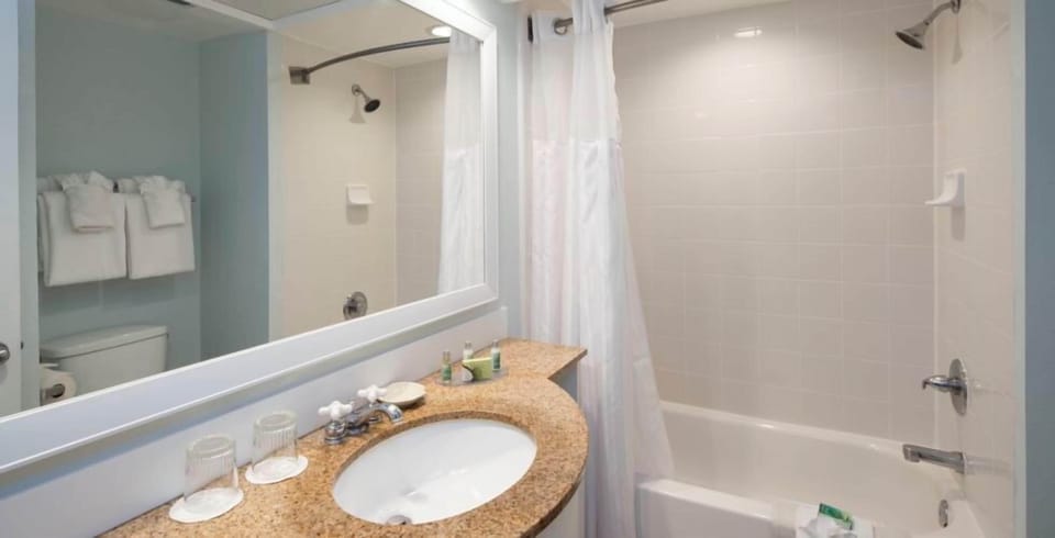 Rinse off comfortably in a bright tub-shower combo.