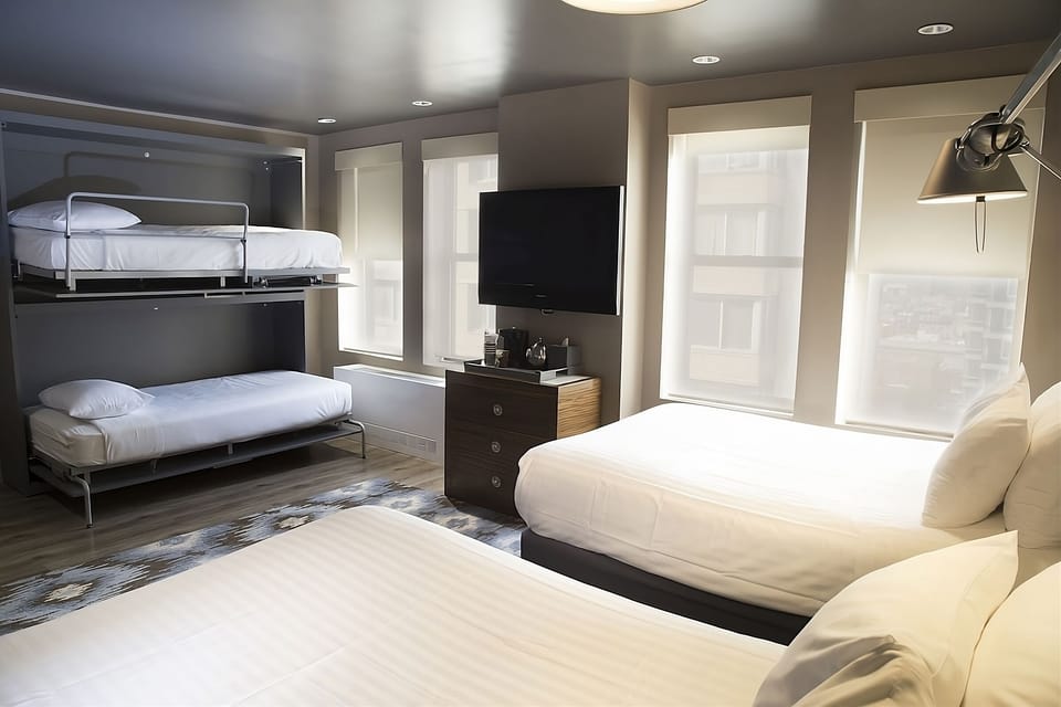 Relax together in a spacious family room with multiple beds.