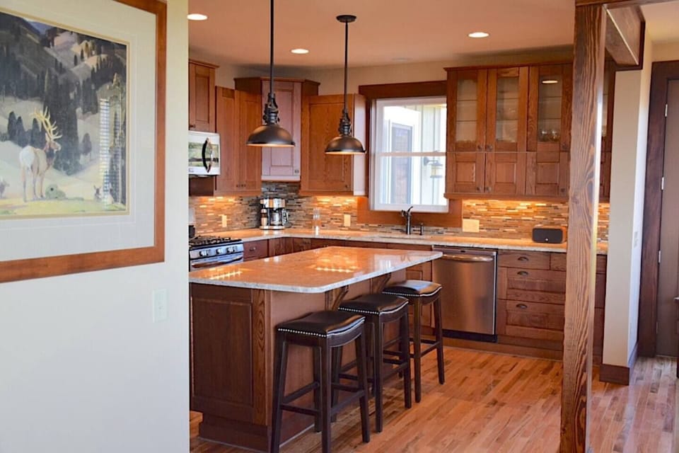 Large Professional kitchen with swedish cabinetry and large Island adjoining the dining room