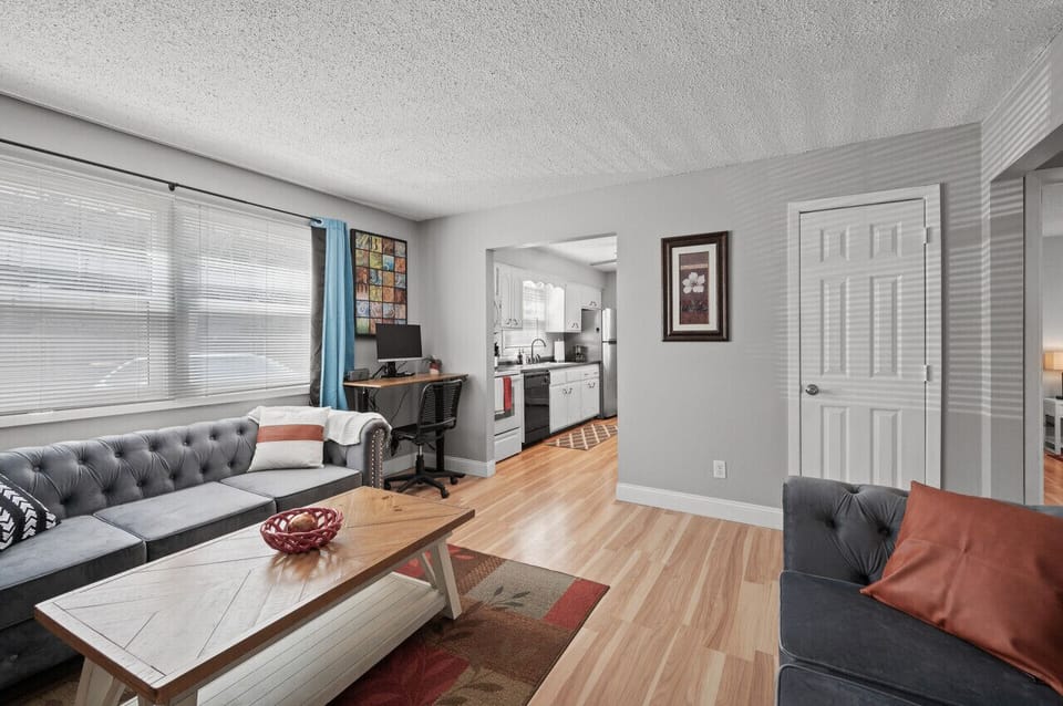 Living Room with windows facing front parking- View 4