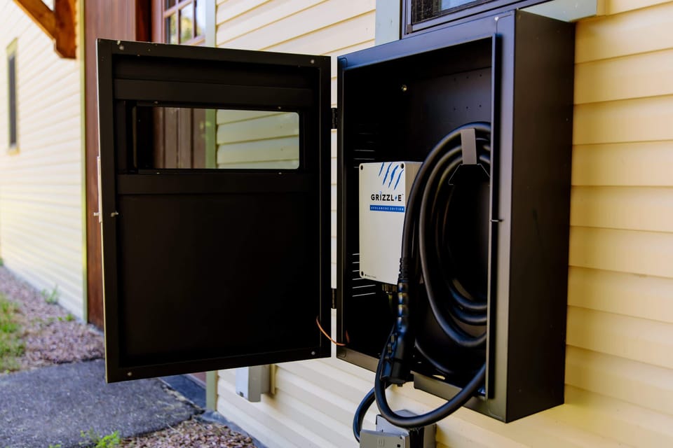 A dedicated Level II EV charger (Tesla Plug) is included at the property exclusively for your use